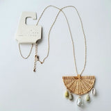 A New Day Long Gold Tone Beige Wicker Fan Charm w Dangling Faux Stone Necklace