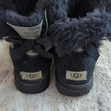 UGG Womens Black Mini Bailey Rear Bow Snake Suede Sheepskin Boots Size 7.5